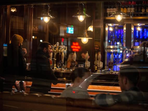 Drinkers enjoy a last pint in Leeds on the Friday before lockdown.