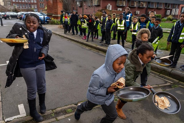 Pupils from St Peter's C.E. Primary School taking part in pancake races at Leeds Minster in February.