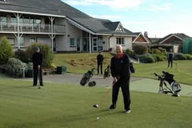 Dave Mahon prepares to strike the first drive after lockdown at Knott End Golf Club