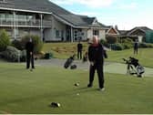 Dave Mahon prepares to strike the first drive after lockdown at Knott End Golf Club