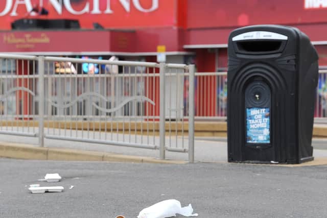 Litter left by a bin on the Promenade in Blackpool