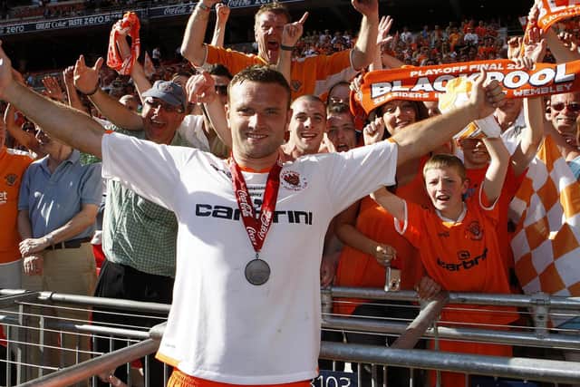 Ian Evatt celebrates promotion with the Blackpool fans a decade ago