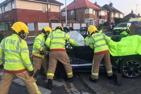 Crews cut open the Citroen to free the casualties Credit: Blackpool Fire