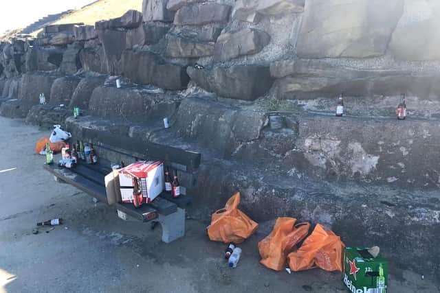 Broken bottles, cans and plastic bags left scattered on a bench on the Lower Promenade in Bispham.