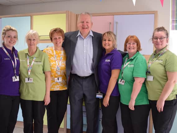 Sir Bill Beaumont with Trinity Hospice staff on being appointed president last year