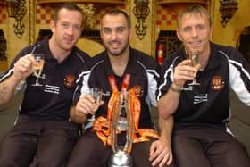 Gary Taylor-Fletcher with the Championship play-off trophy flanked by fellow Wembley goalscorers Charlie Adam (left) and Brett Ormerod
