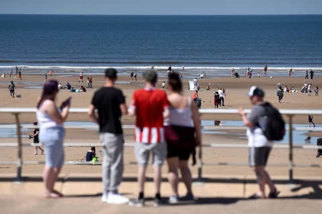 Sunseekers on the Prom and beach at Blackpool at the weekend. There is no suggestion any of those pictured were breaching social distancing rules or lockdown legislation (Picture: Daniel Martino for JPIMedia)