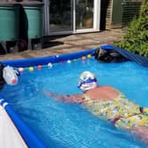 Audrey Hellen swimming the 'channel' in her back garden