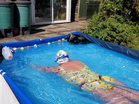 Audrey Hellen swimming the 'channel' in her back garden