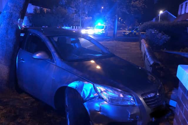 The Vauxhall Insignia finally came to a halt when it crashed into a tree and a garden wall in Marton Drive. Pic: Lancashire Police