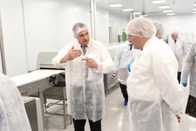 Richard Greathead pictured (left) with Lord Henley (right) at the opening of the protein bar line at Nutrition Group