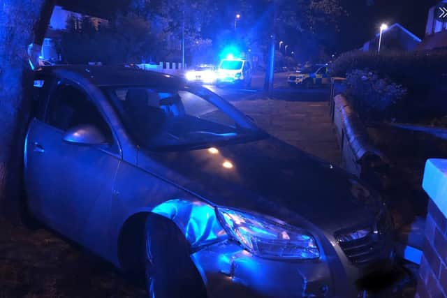 Two men - aged 31 and 28 - were arrested after an alleged wrecking spree across Blackpool late on Thursday, June 4, 2020. It ended when a Vauxhall Insignia, pictured, smashed into a tree and garden wall in Marton Drive, South Shore, following a brief police chase (Picture: Lancashire's Road Policing Unit)