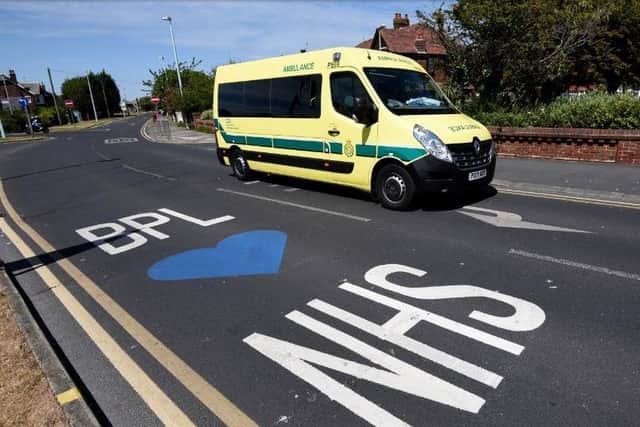 An ambulance drives past a 'Bpl loves NHS' painting on the road outside Blackpool Victoria Hospital on June 3, 2020, during the coronavirus Covid-19 pandemic (Picture: Daniel Martino for JPIMedia)