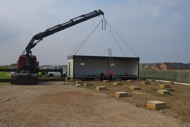 The modular building is dropped into place. Picture courtesy of Blackpool FC