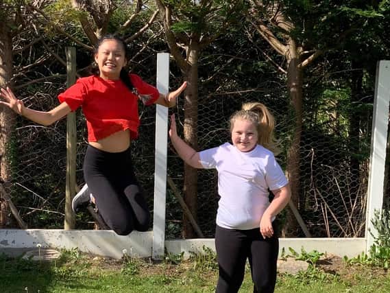 Alyssa Davies, of Wrea Green, who is leading a Cancer Research school sports campaign after recovering from leukaemia pictured with sister Lauren, right