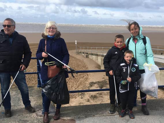 A group of litter pickers aiming to ensure the beach looks its very best