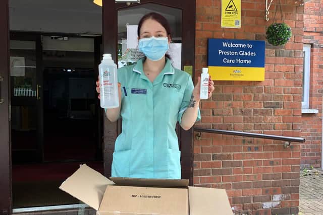 Receiving the UCLan-made sanitiser at Preston Grange