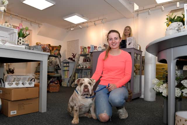 Ready to welcome customer back: Lisa Crane with Elmo the bulldog and Sophie Senar at Harrison Cropper gift and interiors store in Garstang