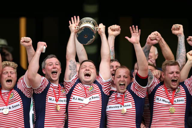Adam Lewis lifts the Bill Beaumont Cup as Lancashire captain in 2018