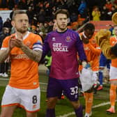 Chris Maxwell (centre) has agreed a new Blackpool deal and club captain Jay Spearing (left) may well follow