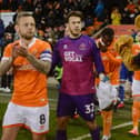 Chris Maxwell (centre) has agreed a new Blackpool deal and club captain Jay Spearing (left) may well follow