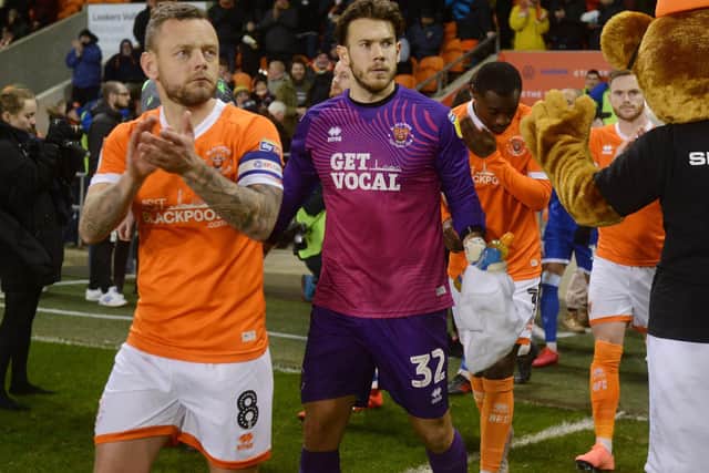 Chris Maxwell (centre) has agreed a new Blackpool deal and club captain Jay Spearing (left) may well follow