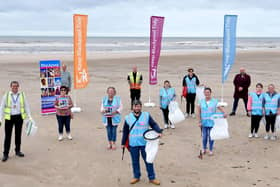 Members of the Big Blackpool Beach Clean wearing the vests provided by StayBlackpool