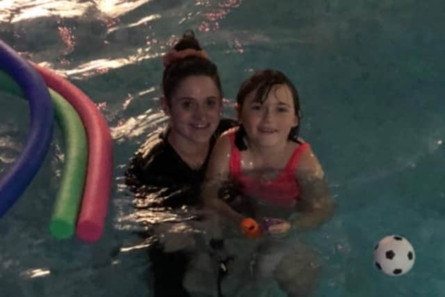 Swim teacher Charlotte Crabtree with client Tabitha
