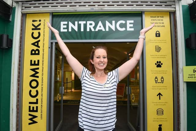 Laura Ockenden at the new entrance signs