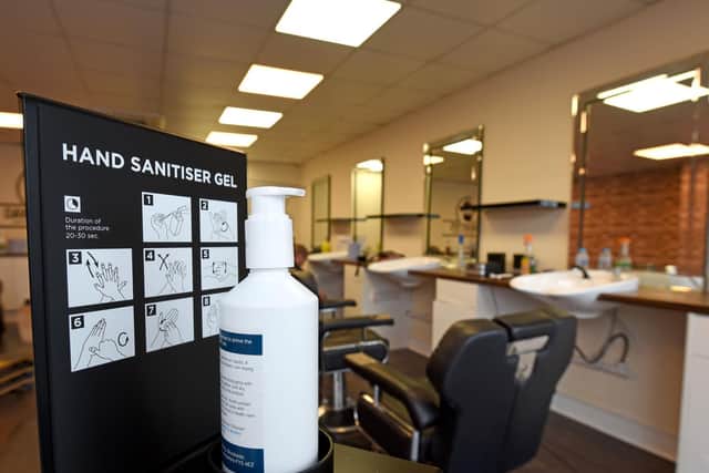 A visit to Dave Gotto's Barbers now comes with a hand sanitising station, face masks and barbers wearing visors to keep customers and staff safe.