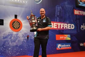 2019 World Matchplay champion Rob Cross with the Phil Taylor Trophy at Blackpool's Winter Gardens