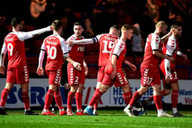 Fleetwood celebrate their late Boxing Day winner at Rochdale scored by Wes Burns (far right)