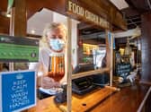 There will be a number of safety measures in place at pubs, including protective screens at the bar. Credit: Joe Giddens/PA Wire