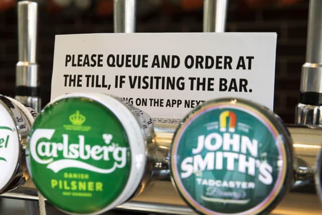 Having a pint in the pub will be a bit different this weekend due to new restrictions. Credit: Photo by Dan Kitwood/Getty Images