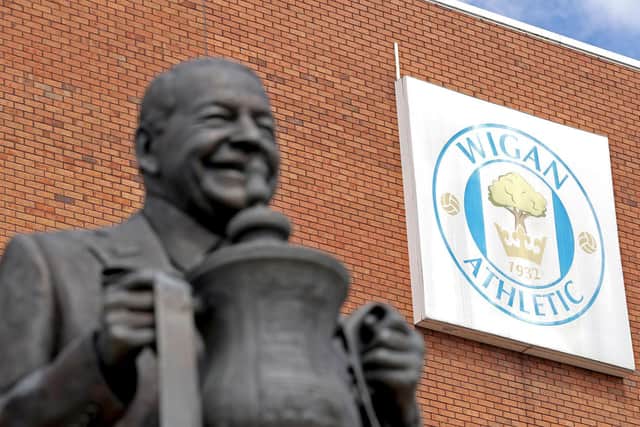 A statue of former owner Dave Whelan stands outside Wigan's DW Stadium