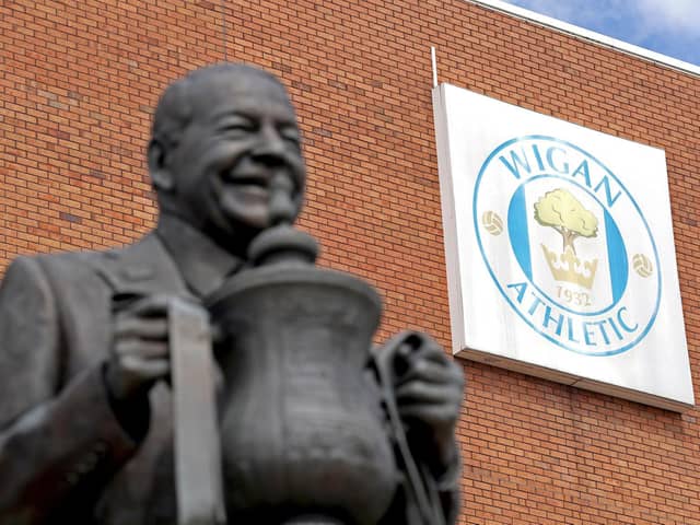 A statue of former owner Dave Whelan stands outside Wigan's DW Stadium