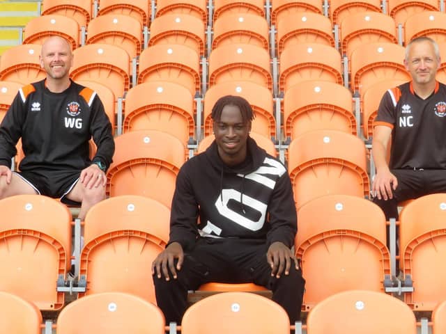 Antwi with academy manager Warren Green and first-team head coach Neil Critchley