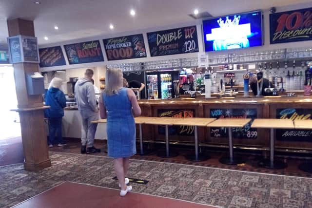 Waiting for bar service at The Rose and Crown