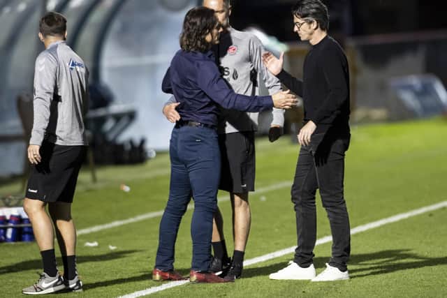 Joey Barton congratulates Wycombe boss Gareth Ainsworth at full-time on Monday