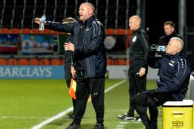 Managerial duo Jim Bentley (left) and Kenny McKenna (seated) are to be separated Picture: STEVE MCLELAN