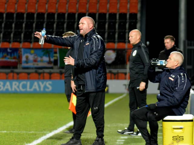 Managerial duo Jim Bentley (left) and Kenny McKenna (seated) are to be separated Picture: STEVE MCLELAN