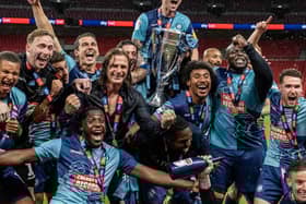 Wycombe celebrate their promotion to the Championship