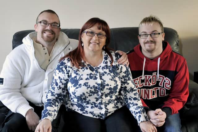 Janet Williams with her sons, left, Lee Williams and right, Philip Williams