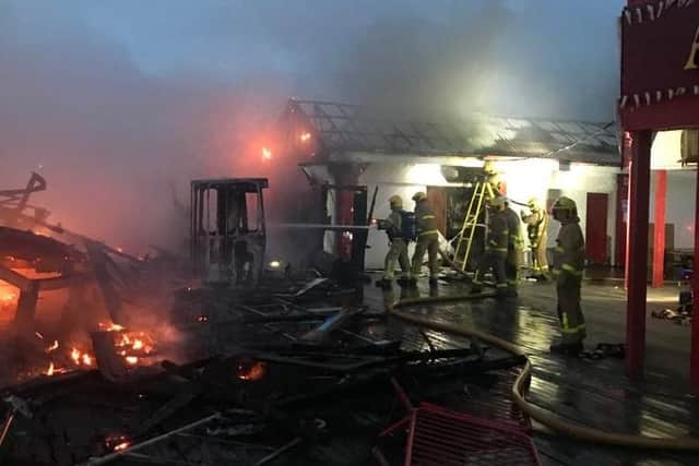 Fire crews tackling the Waltzer fire at Central Pier this morning (July 17)