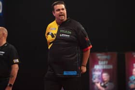 Debutant Gabriel Clemens defeated champion Rob Cross in the first round at Milton Keynes