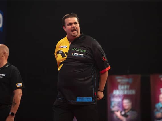 Debutant Gabriel Clemens defeated champion Rob Cross in the first round at Milton Keynes