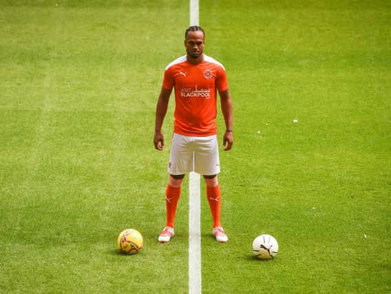 Nathan Delfouneso models the new Blackpool home kit