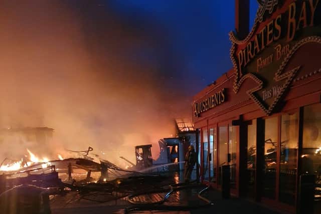 A fire broke out on Blackpool's Central Pier at 3.20am on Friday, July 17, 2020. The blaze, which threatened to engulf the 150-year-old attraction, started in a workshop before spreading to the waltzers and another nearby ride (Picture: South Shore Fire Station/Twitter/Lancashire Fire and Rescue Service)