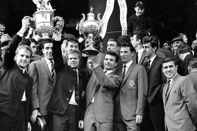 The Leeds United squad on the Town Hall steps celebrate winning the Second Division title in 1964