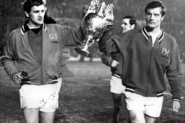 Gary Sprake and Paul Madeley proudly parade the First Division trophy after Leeds United won the title in 1968/69.